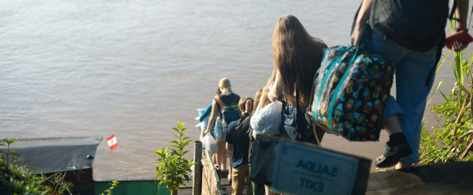 Participants in Peru pack up their things and head towards their boat